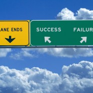 Freeway sign in blue cloudy skies reading Success and Failure
